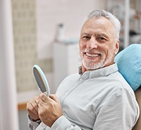 Senior man enjoying his new dental implant restorations