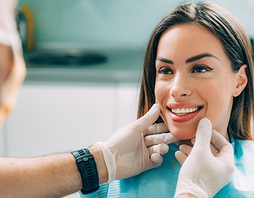 Smiling woman in dental exam chair