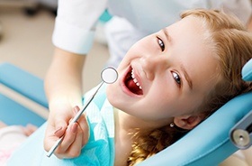 Smiling child in dental chair
