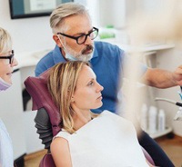 Emergency dentist explaining X-ray to patient