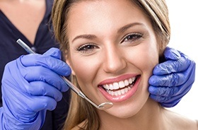 Woman smiling during her dental appointment