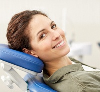 Happy patient attending checkup to prevent dental emergencies