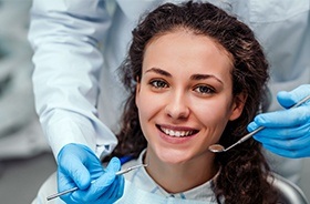 Woman in dental chair smiling