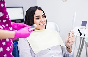 happy dental patient with mirror