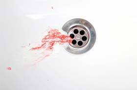 Blood mixed with toothpaste, indicating possible dental implant failure