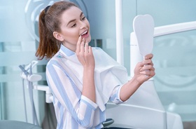 happy dental patient with mirror