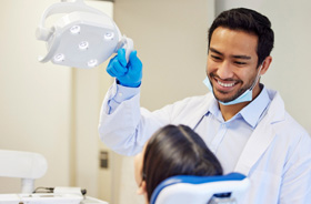 Dentist preparing to perform an examination