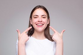 Woman smiling, enjoying the benefits of root canal therapy