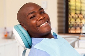 Smiling man in dental chair