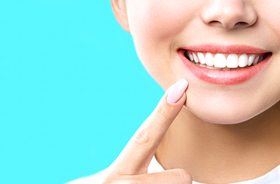 Woman’s smile with healthy teeth and pink gums