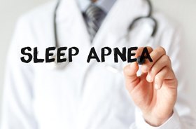 doctor writing “sleep apnea”