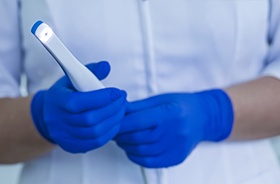 Dentist holding an intraoral camera