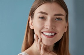 Woman with bright teeth after whitening treatment