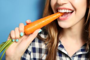 Eating a carrot to maintain results of teeth whitening in Plymouth