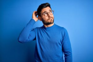 Puzzled man with questions about root canals in Plymouth