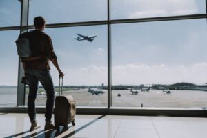 Man standing with his suitcase in airport
